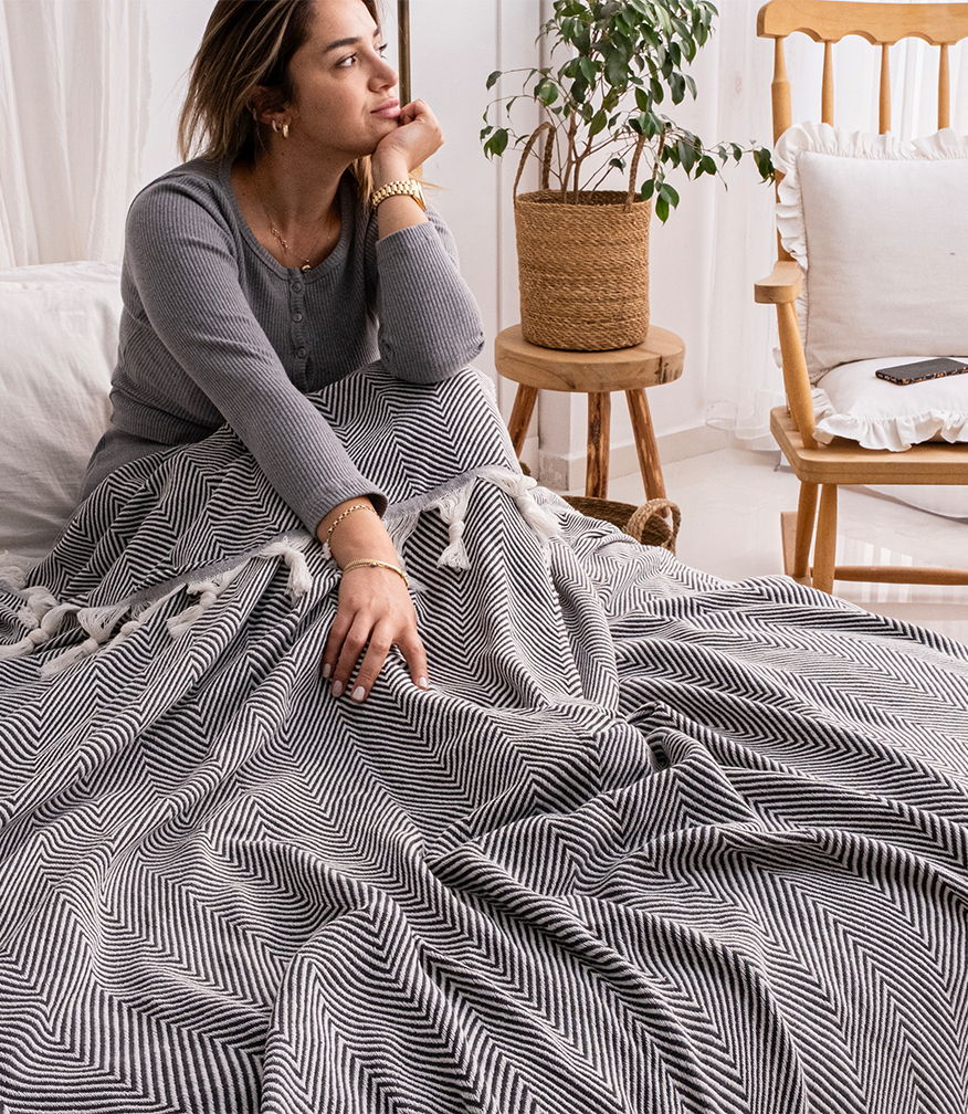 Milam London herringbone throw styled on an armchair